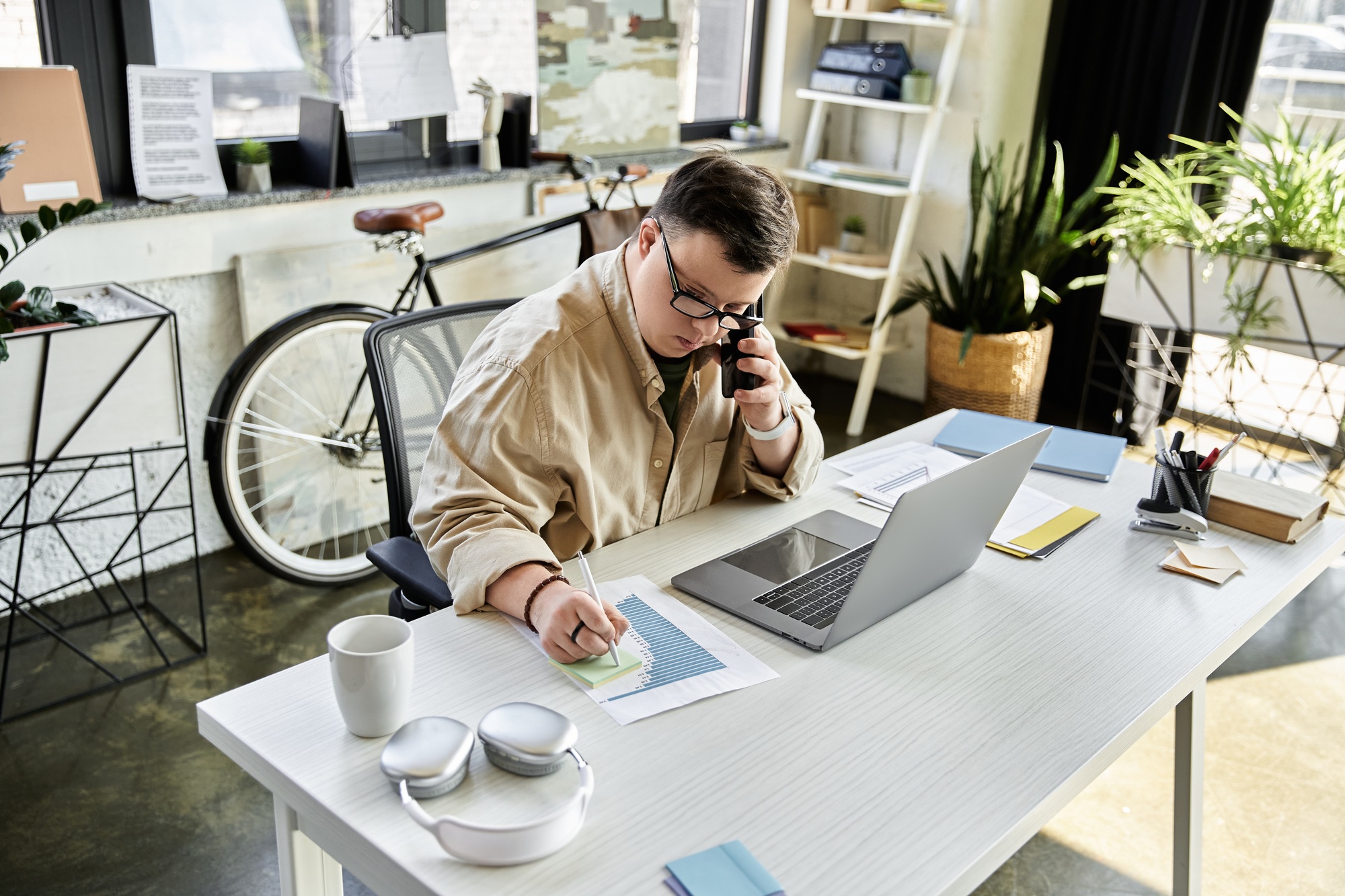 Young Man on the Phone at His Desk